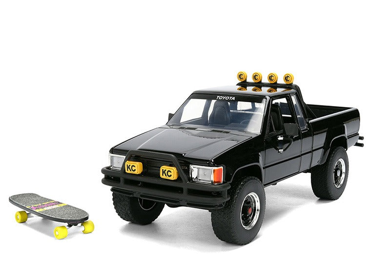 Jada 36479 Back To The Future 1985 Toyota SR5 Pick Up Truck with Marty’s Skateboard 1:24 Black