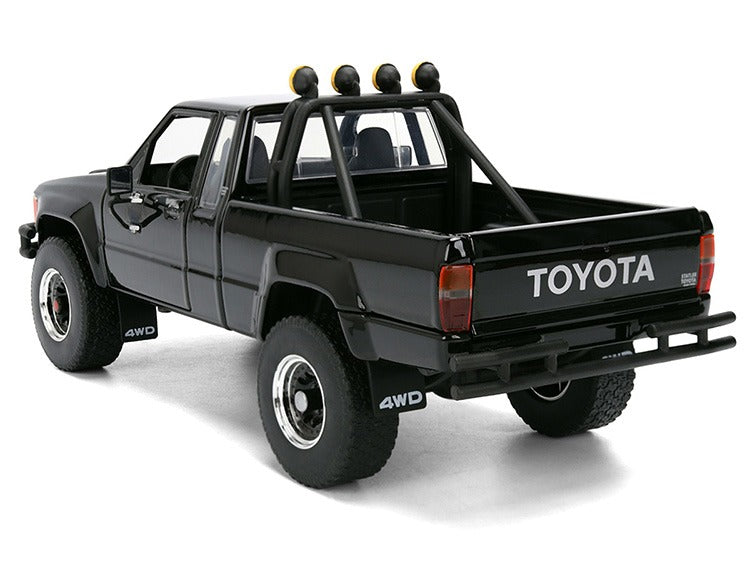 Jada 36479 Back To The Future 1985 Toyota SR5 Pick Up Truck with Marty’s Skateboard 1:24 Black