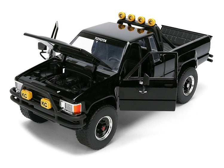 Jada 36479 Back To The Future 1985 Toyota SR5 Pick Up Truck with Marty’s Skateboard 1:24 Black