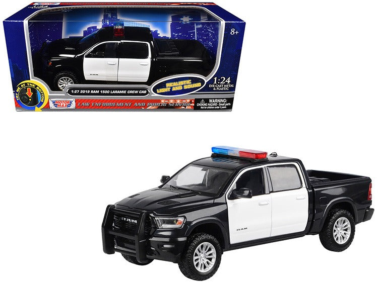 Motormax 79544 2019 Ram 1500 Laramie Crew Cab 1:27 with Light and Sound Black / White